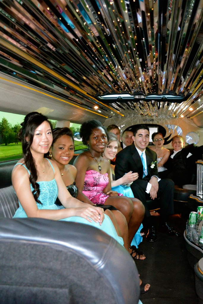 The group enjoys renting a limo for prom service