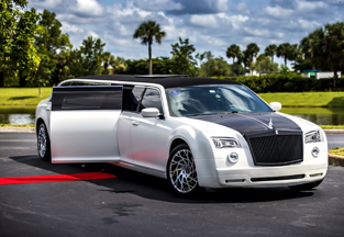 Hire a car like this white and black luxury rolls royce standing on the road.